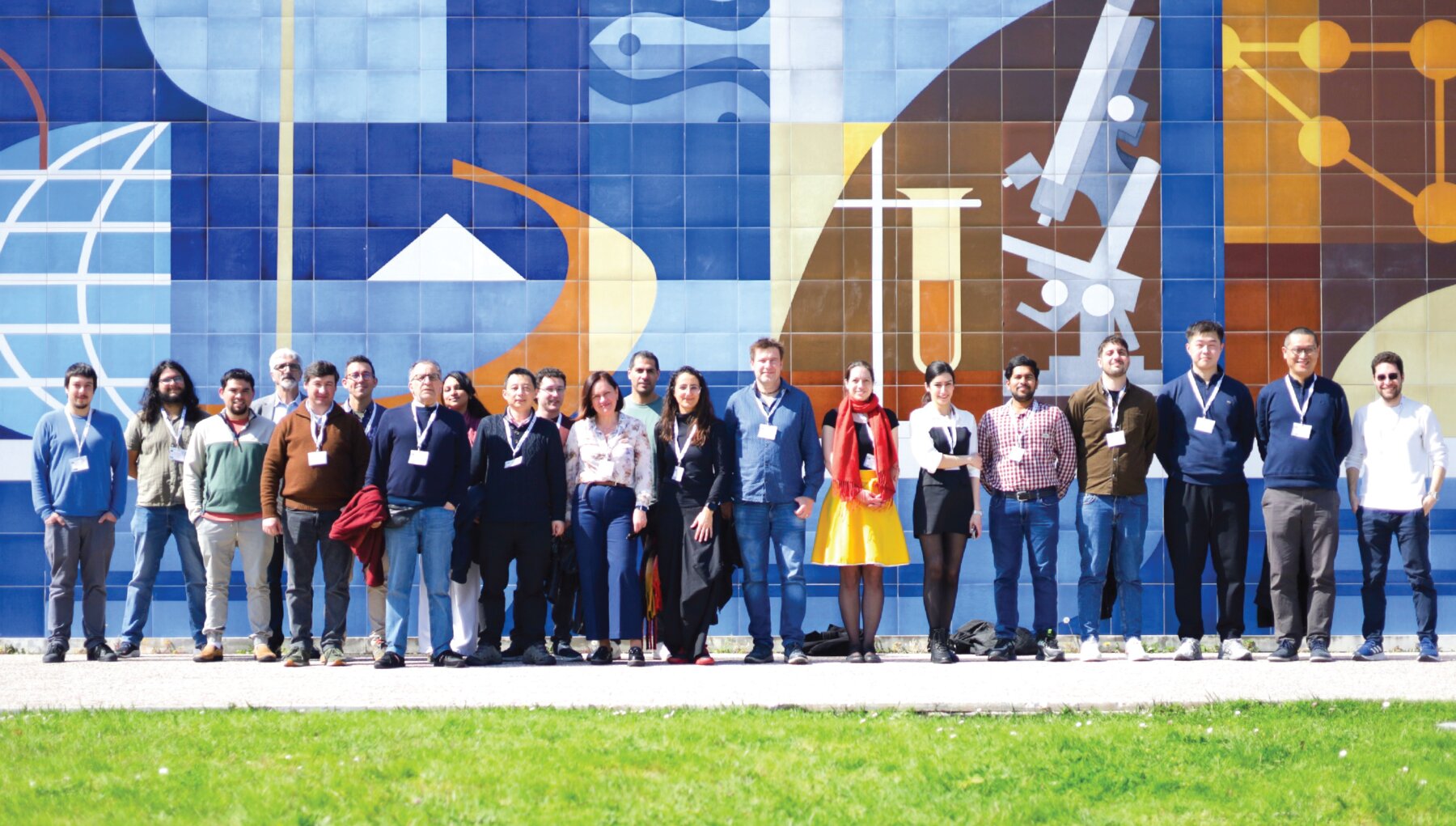 ECRN-OWC researchers gathered in front of a science-themed mural
